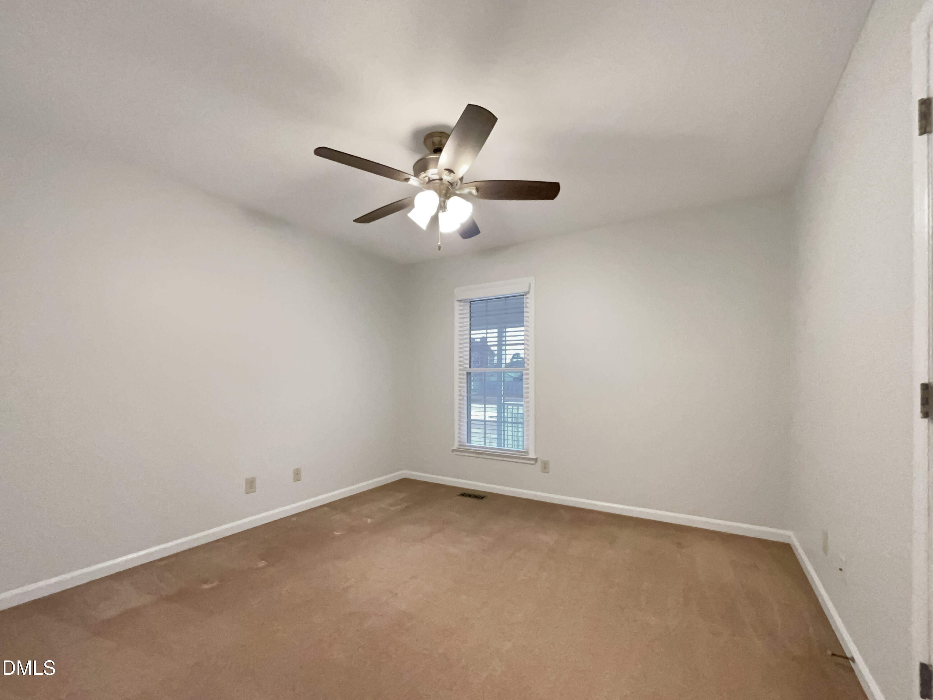 3257 Alforodo Street Fayetteville, NC 28306 - Photo 11 of 18 wooden floor in an empty room with a window