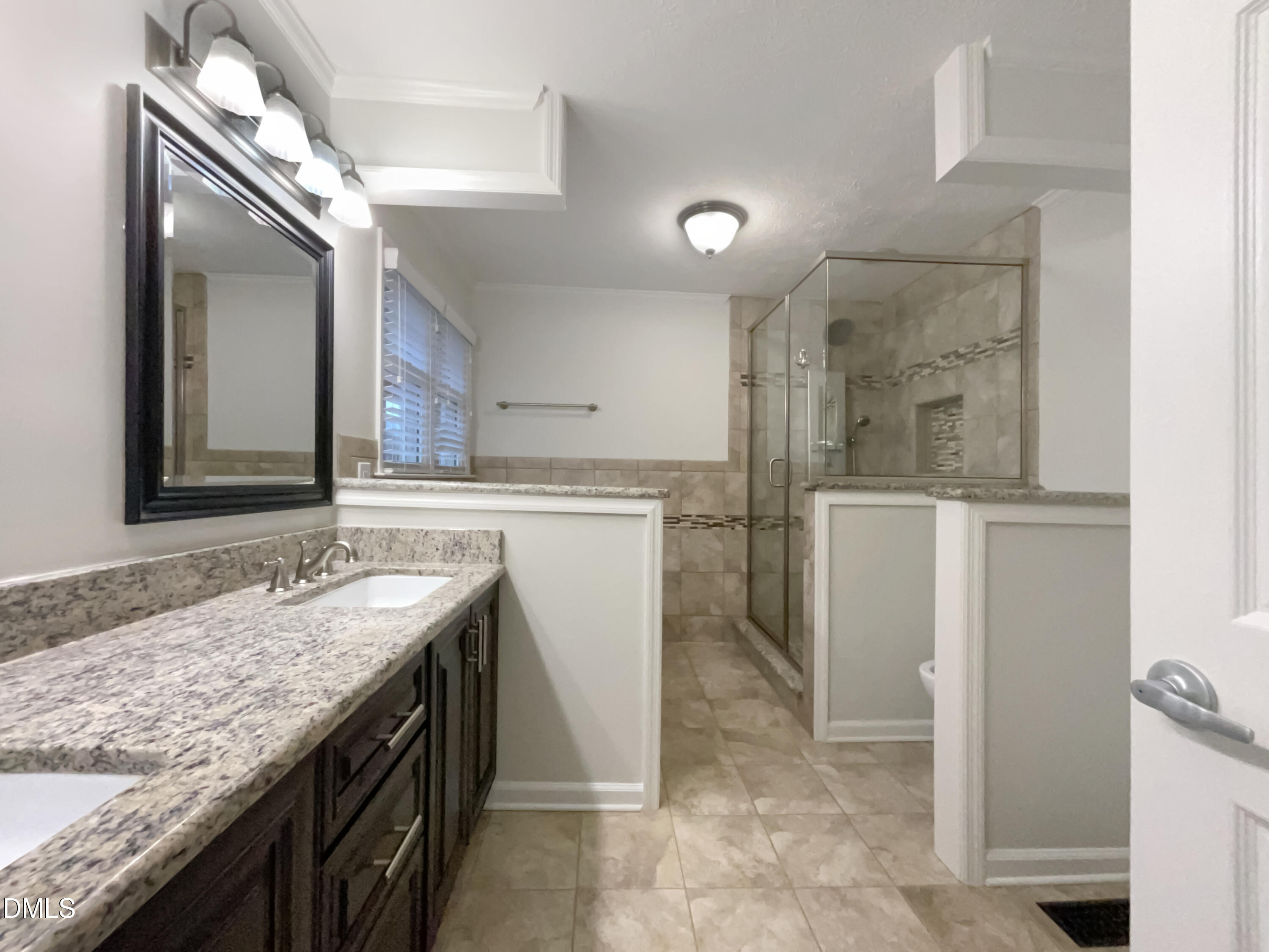 3257 Alforodo Street Fayetteville, NC 28306 - Photo 15 of 18 a bathroom with a granite countertop sink and a mirror