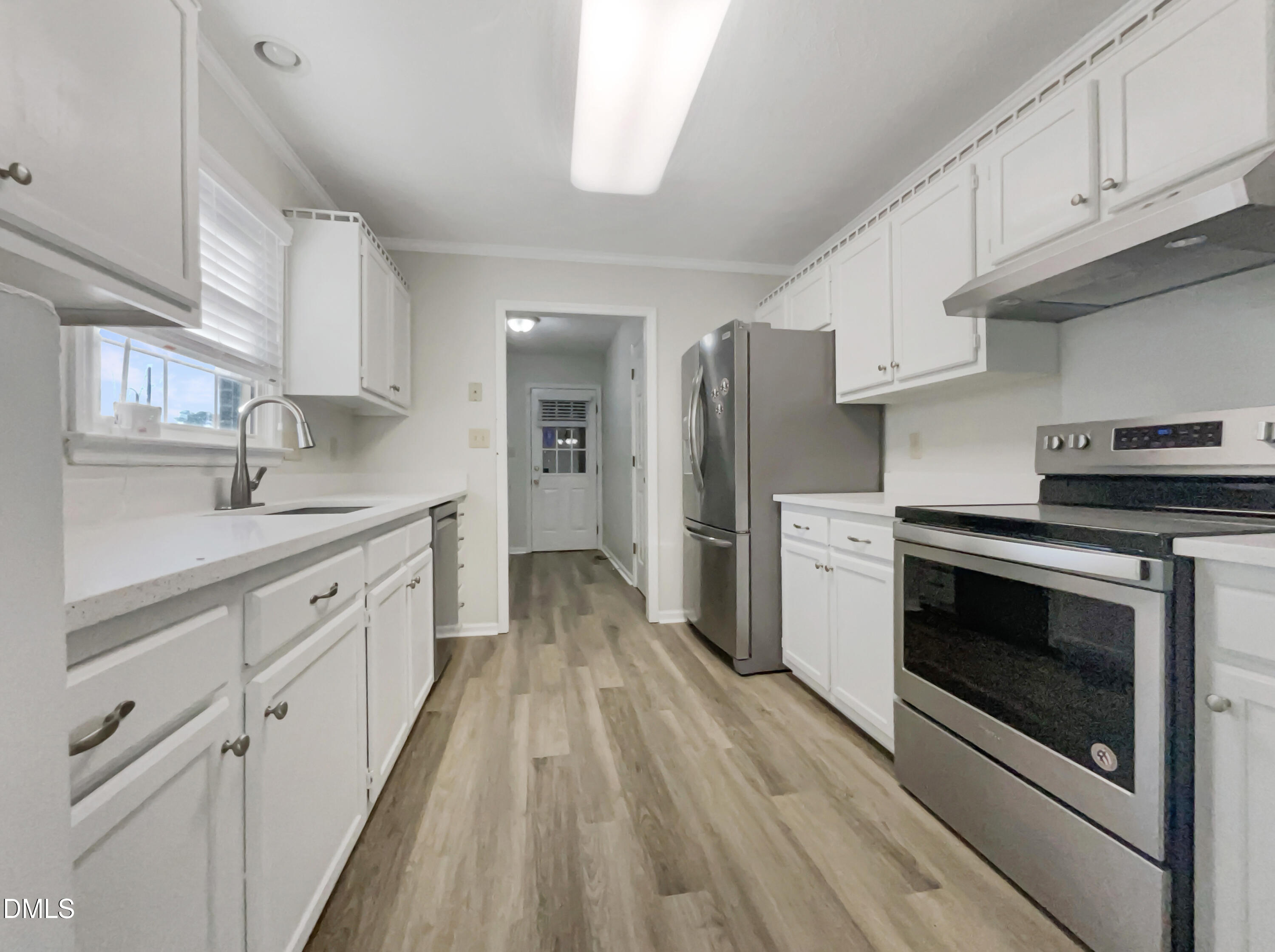 3257 Alforodo Street Fayetteville, NC 28306 - Photo 2 of 18 a kitchen with stainless steel appliances a stove a sink and a refrigerator