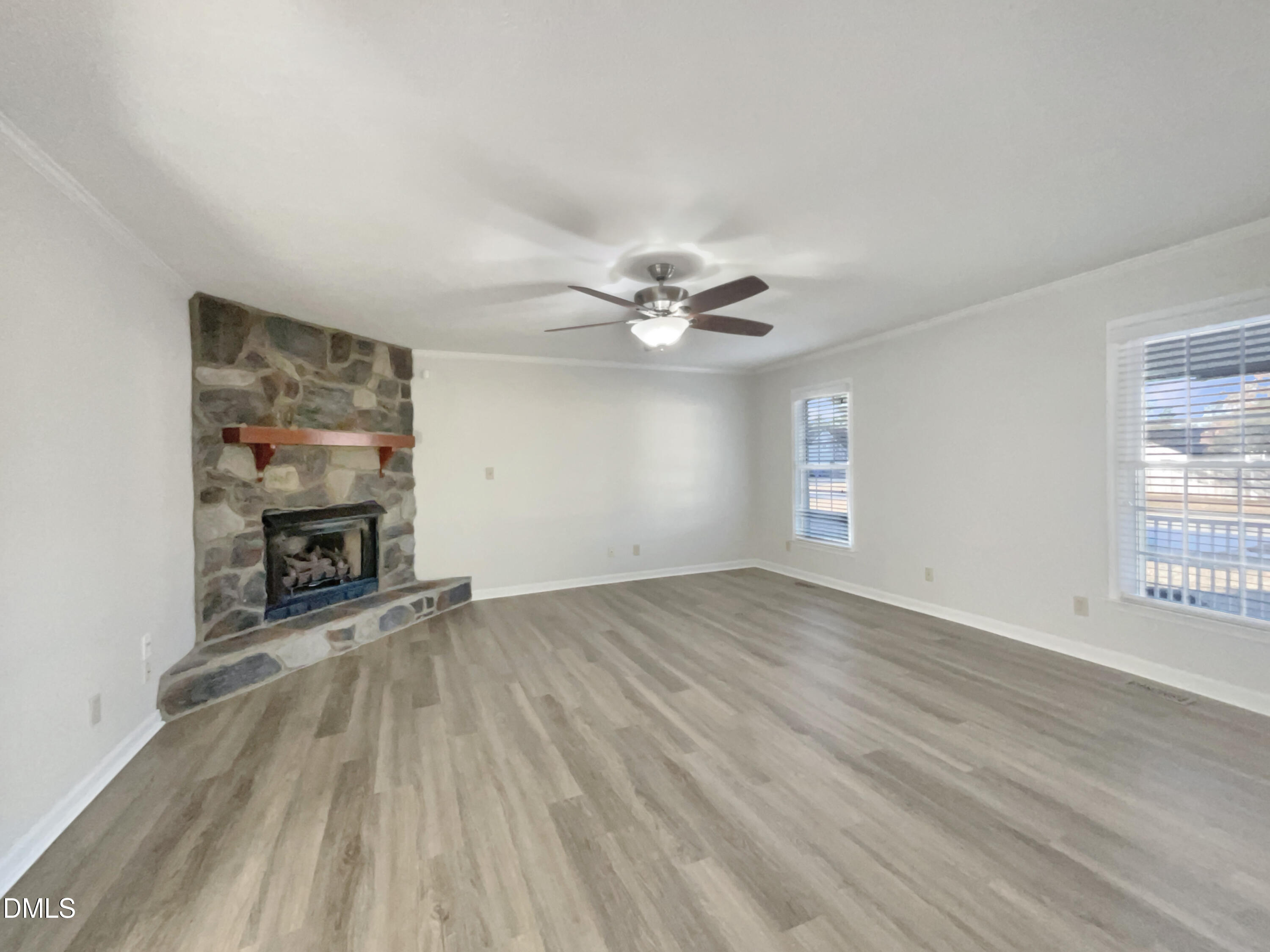 3257 Alforodo Street Fayetteville, NC 28306 - Photo 4 of 18 an empty room with windows and fireplace