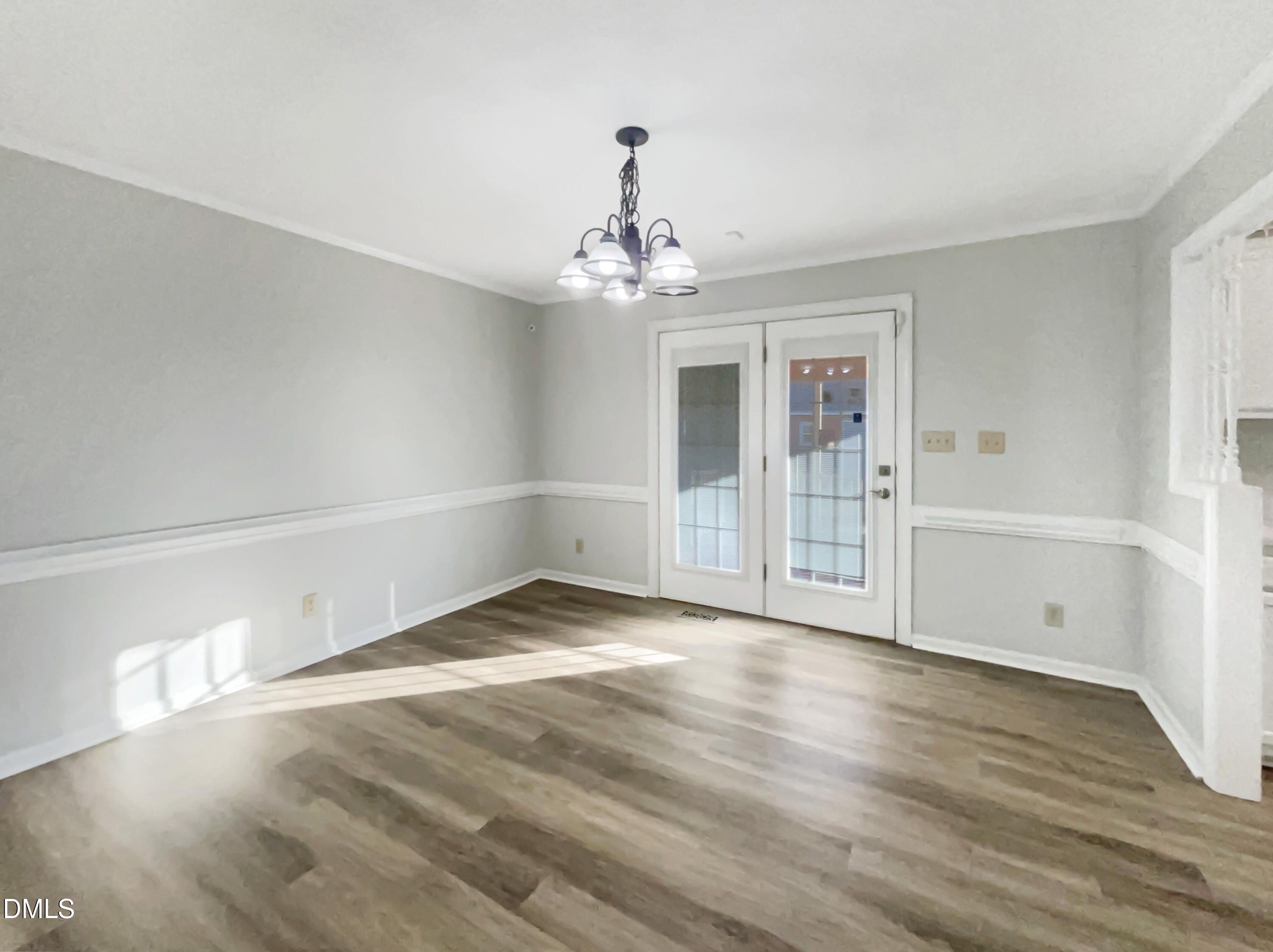 3257 Alforodo Street Fayetteville, NC 28306 - Photo 7 of 18 a view of a livingroom with wooden floor and a ceiling fan