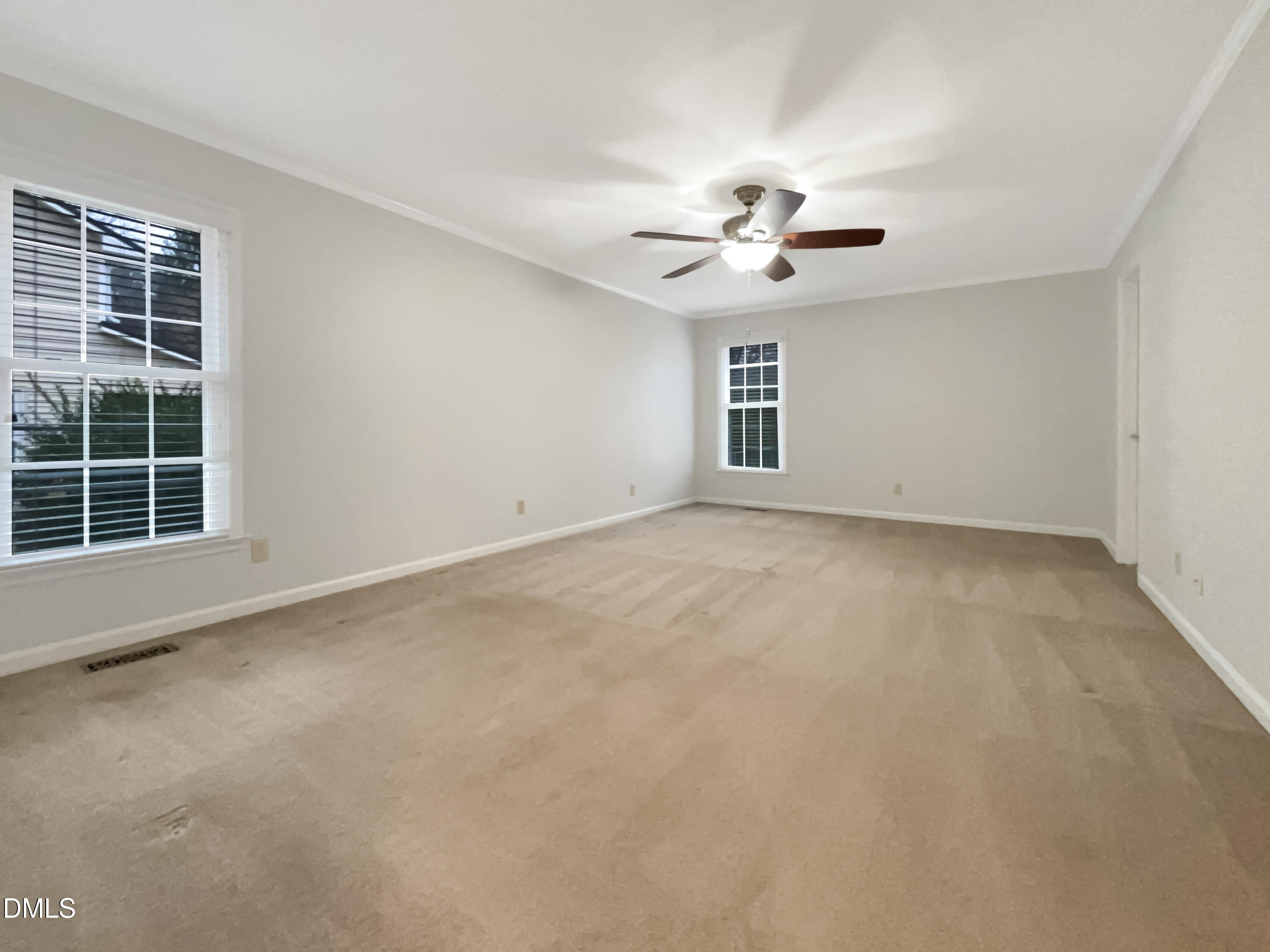3257 Alforodo Street Fayetteville, NC 28306 - Photo 10 of 18 an empty room with windows and ceiling fan