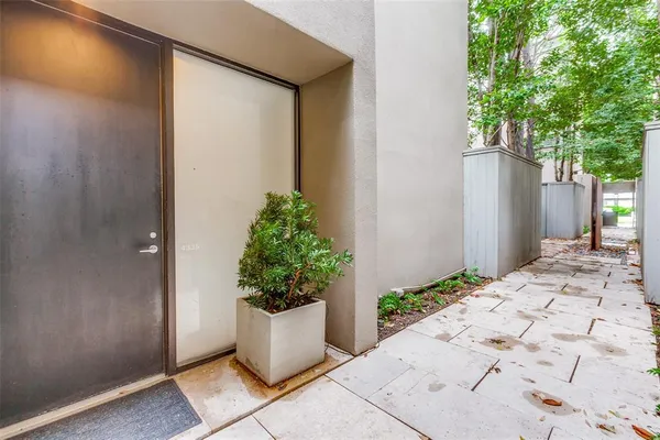 a view of a entryway with flower plants