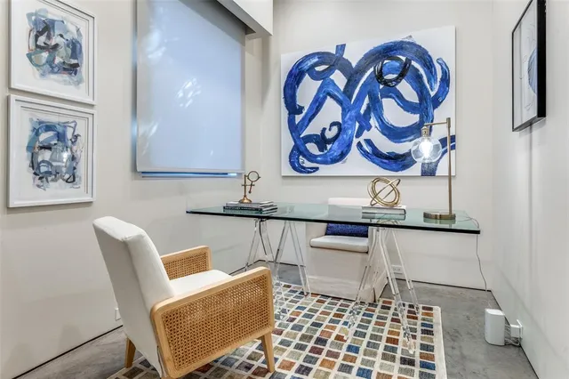 a room with furniture and wall paintings