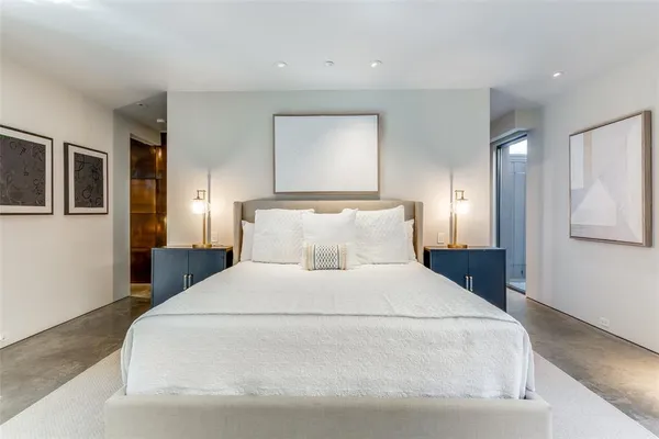 a large white bed in a white room