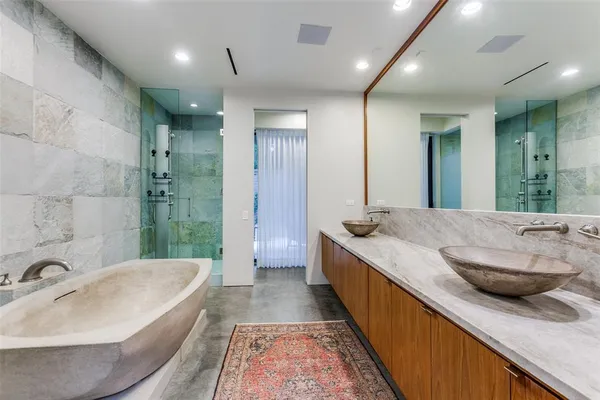 a large spacious bathroom with a double vanity sink and a large mirror