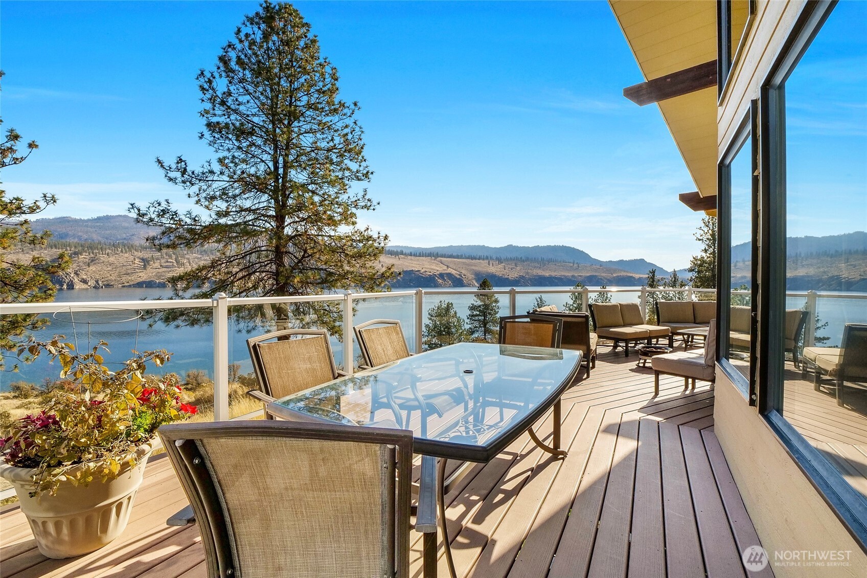 45220 Rantz Park Lane North Wilbur, WA 99185 - Photo 13 of 39 a view of a balcony with chairs and wooden floor