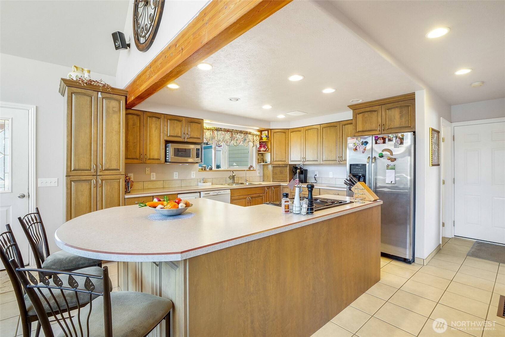 45220 Rantz Park Lane North Wilbur, WA 99185 - Photo 16 of 39 a kitchen with stainless steel appliances granite countertop a sink a stove a refrigerator a dining table and chairs