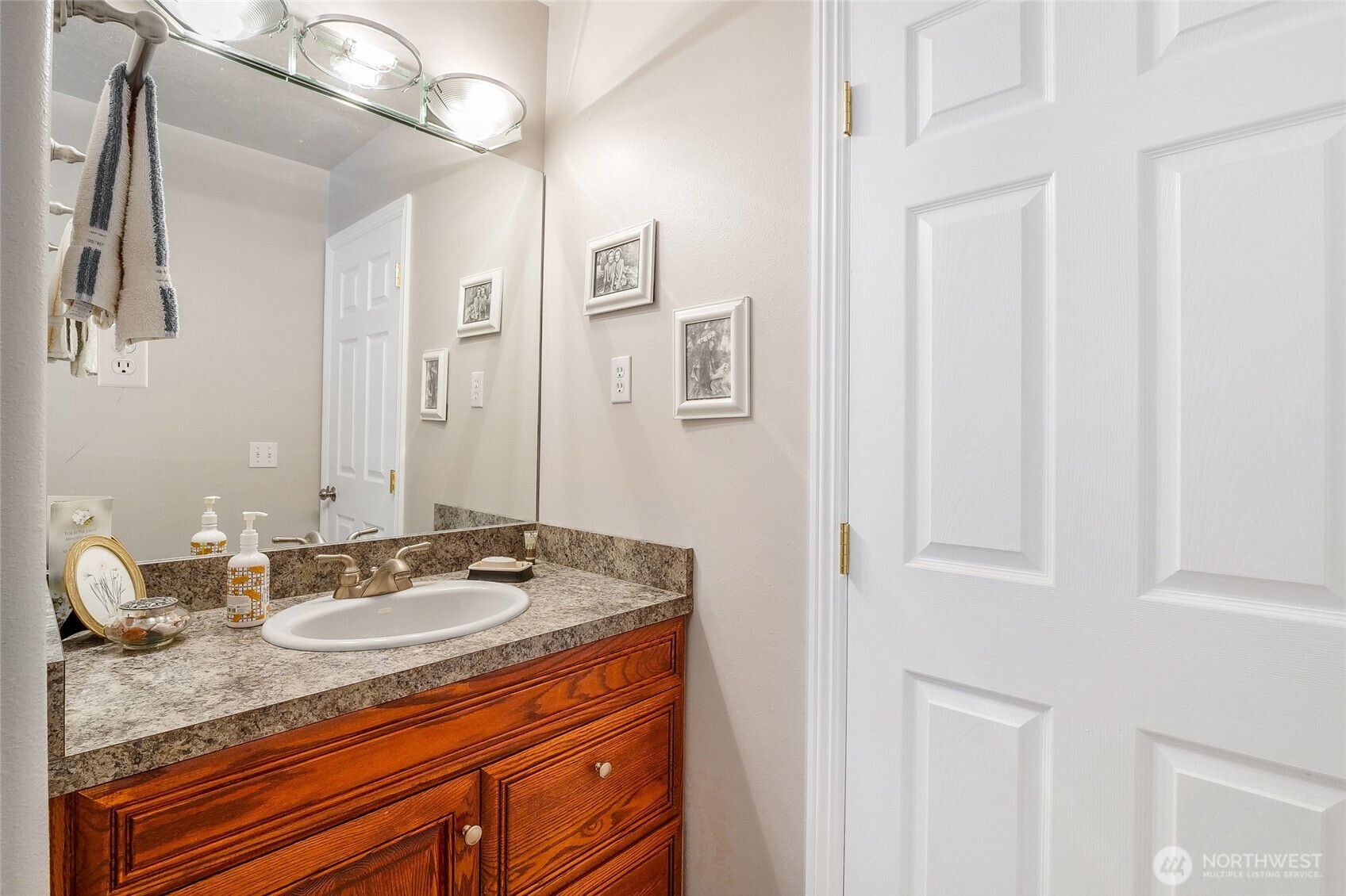 45220 Rantz Park Lane North Wilbur, WA 99185 - Photo 21 of 39 a bathroom with a granite countertop sink and a mirror