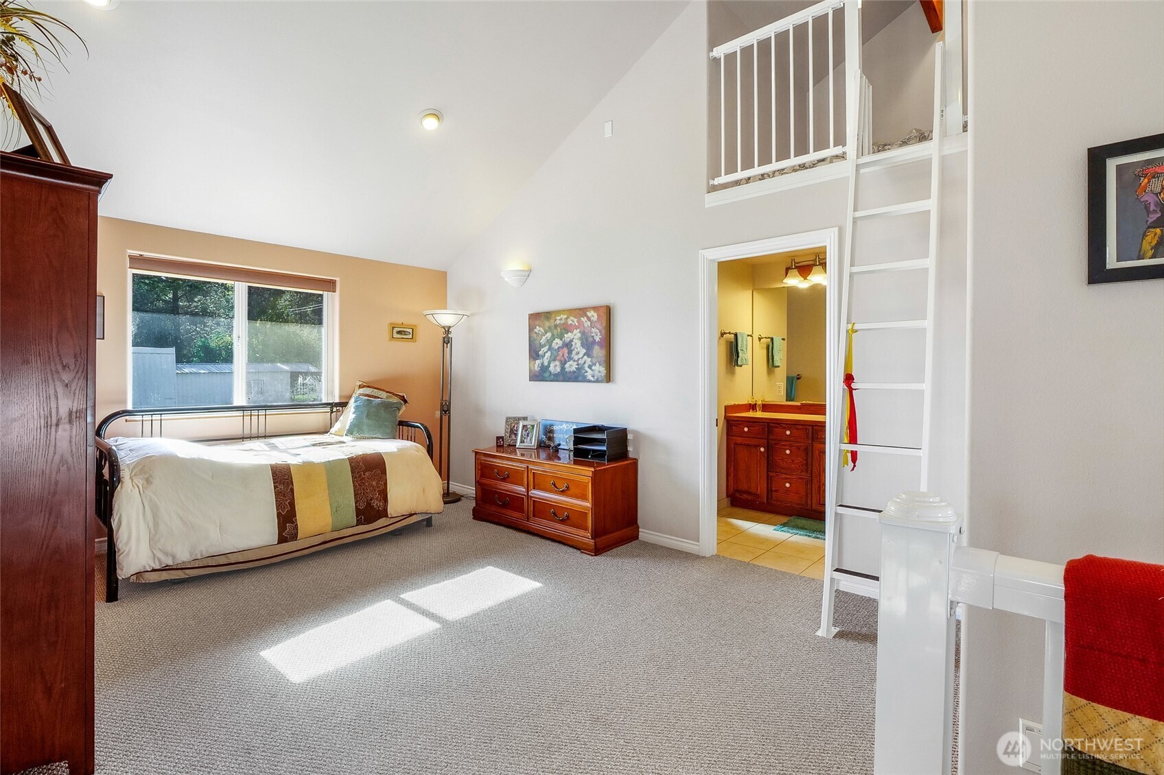 45220 Rantz Park Lane North Wilbur, WA 99185 - Photo 23 of 39 a spacious bedroom with a bed and a couch