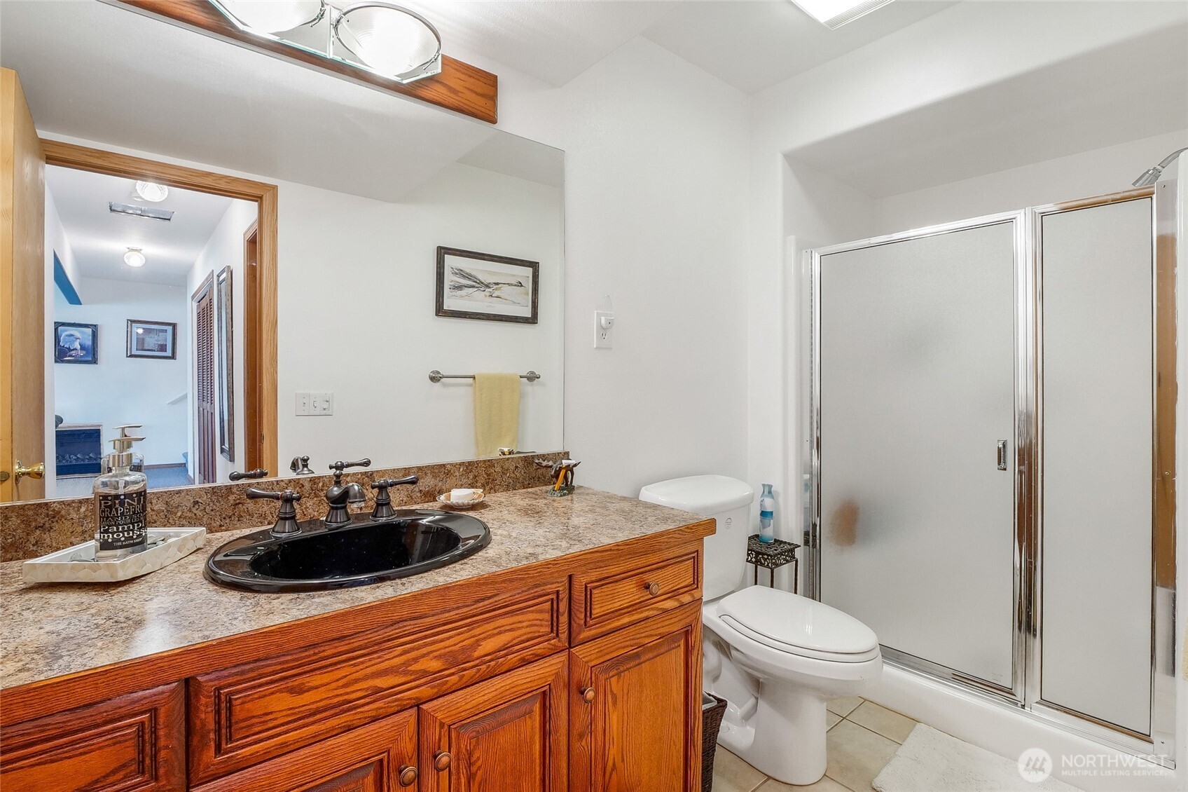 45220 Rantz Park Lane North Wilbur, WA 99185 - Photo 30 of 39 a bathroom with a sink a toilet a mirror and shower