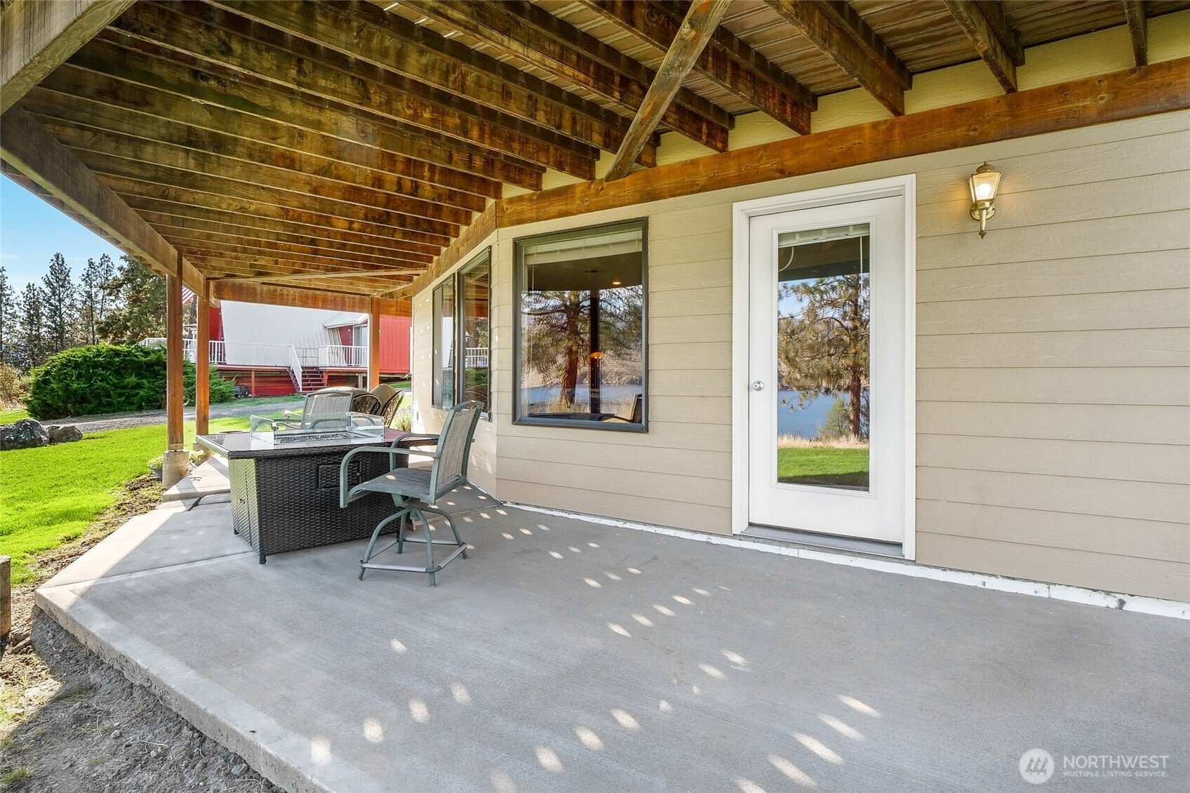 45220 Rantz Park Lane North Wilbur, WA 99185 - Photo 32 of 39 a view of a porch with chairs and backyard