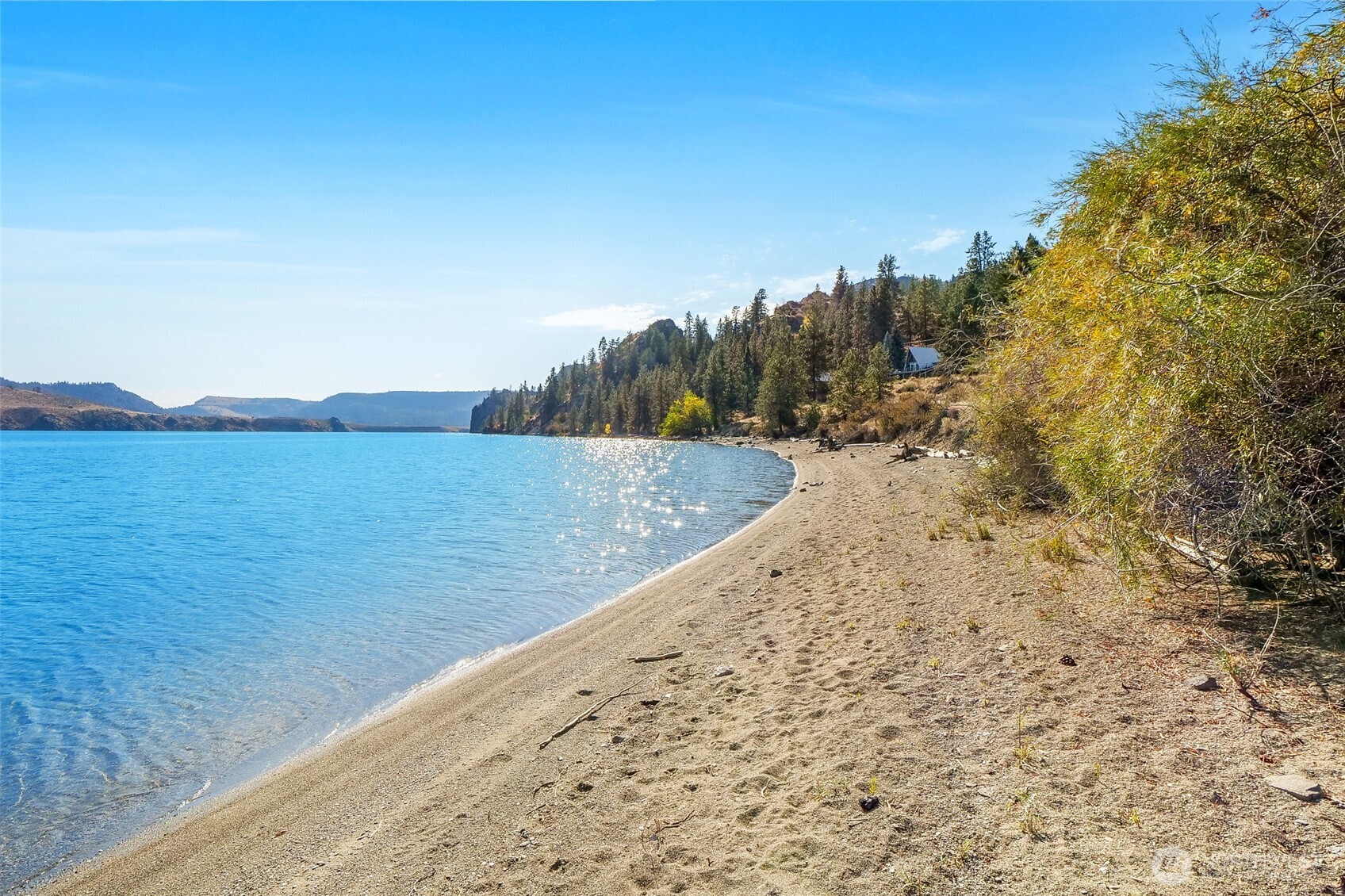 45220 Rantz Park Lane North Wilbur, WA 99185 - Photo 36 of 39 a view of a lake with a mountain in the back