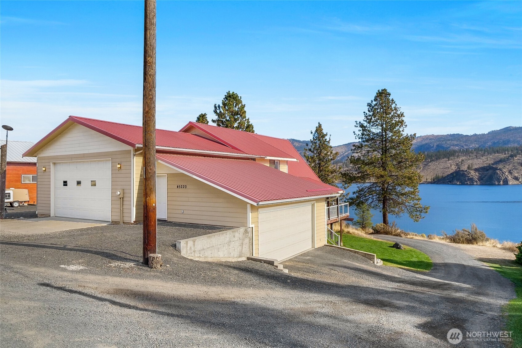 45220 Rantz Park Lane North Wilbur, WA 99185 - Photo 6 of 39 a yellow and red house with a yard