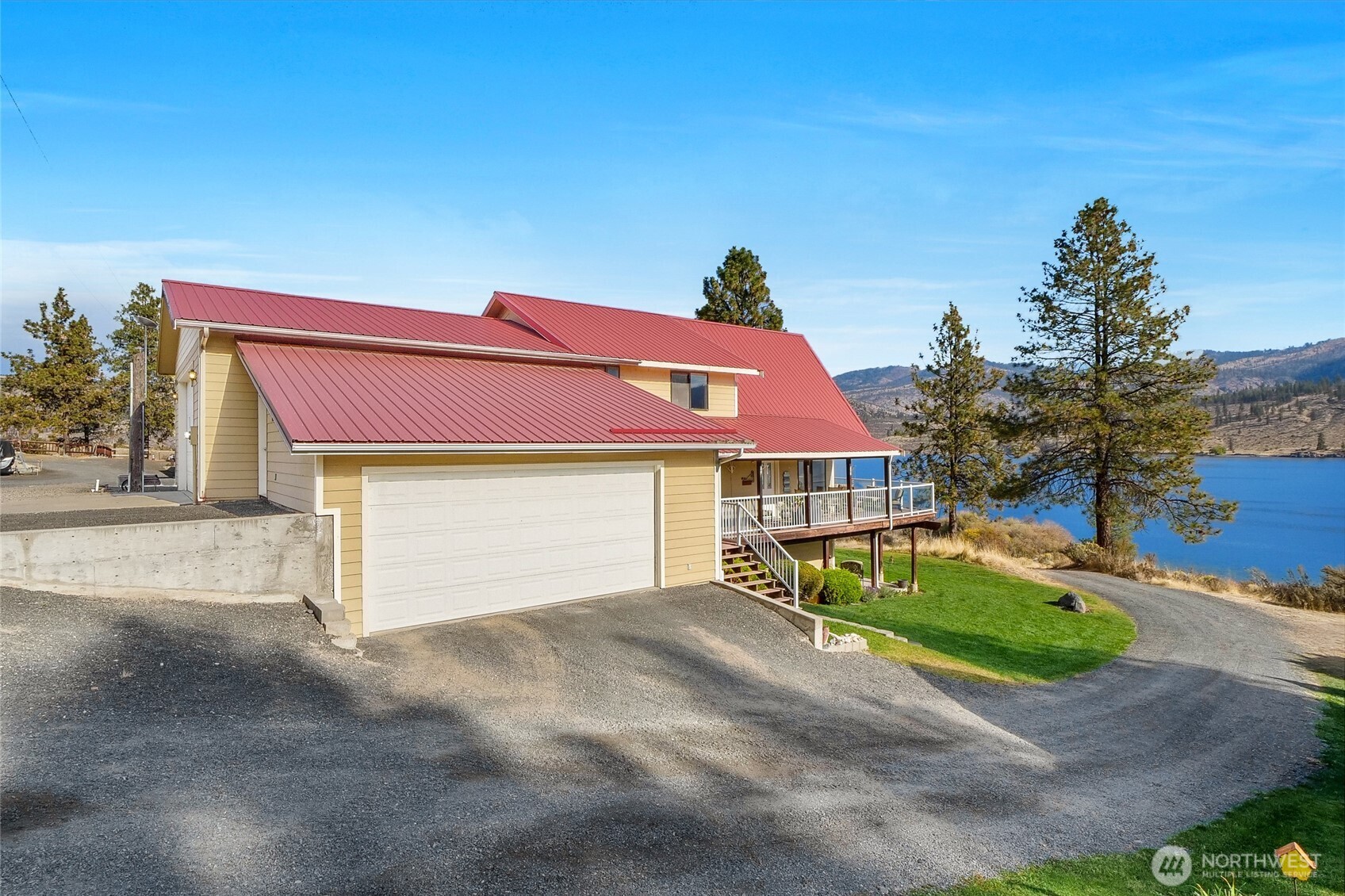 45220 Rantz Park Lane North Wilbur, WA 99185 - Photo 8 of 39 a front view of a house with a yard and garage