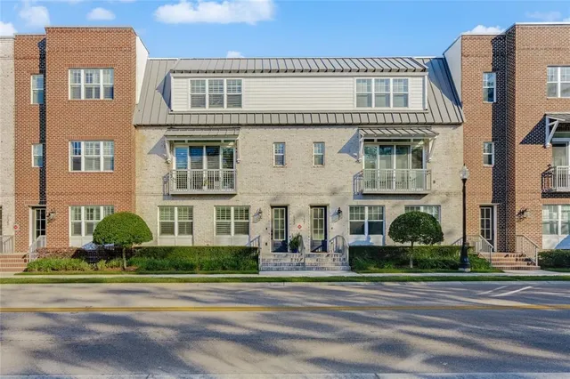a bedroom with a bed and a potted plant