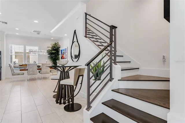 a bedroom with a bed and a table