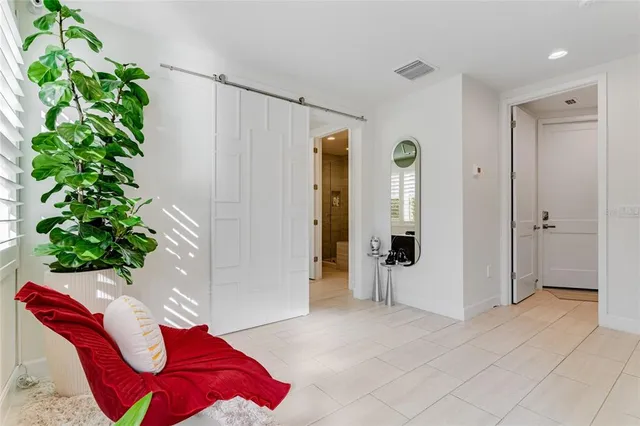 a kitchen with stainless steel appliances kitchen island granite countertop a refrigerator and microwave