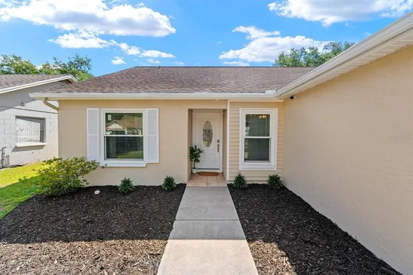 a bedroom with a bed and a television