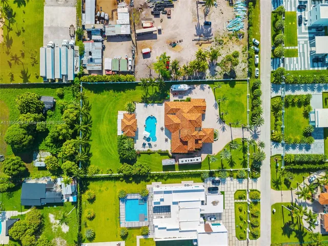 an aerial view of a house with a garden lake view