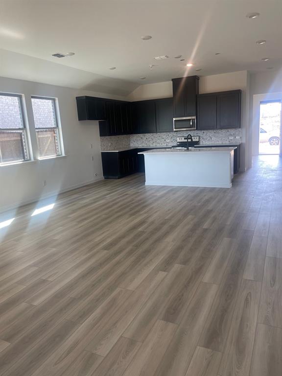 1825 Plymouth Drive Princeton, TX 75407 - Photo 9 of 23 a view of kitchen with a sink and wooden floor