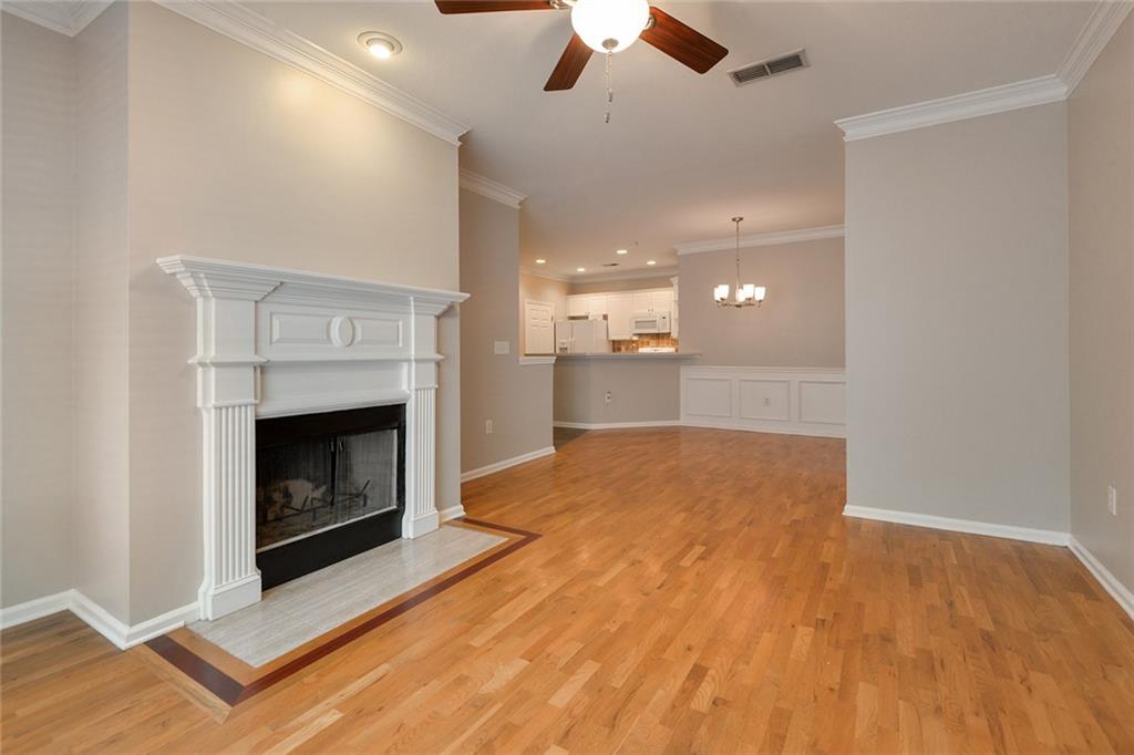 2400 Cumberland Parkway Southeast, Unit 611 Atlanta, GA 30339 - Photo 11 of 26 a view of a room with kitchen and fireplace
