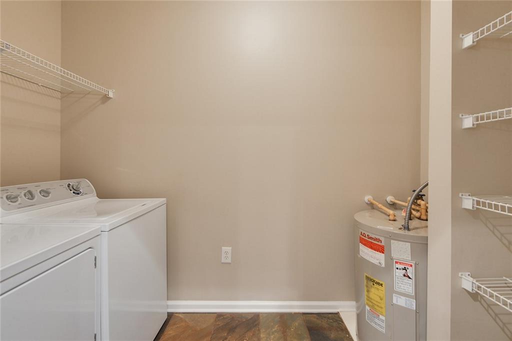 2400 Cumberland Parkway Southeast, Unit 611 Atlanta, GA 30339 - Photo 15 of 26 a utility room with dryer and washer