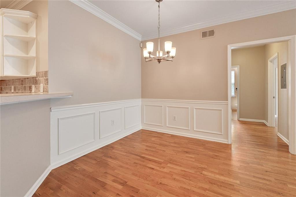 2400 Cumberland Parkway Southeast, Unit 611 Atlanta, GA 30339 - Photo 16 of 26 a view of empty room with wooden floor and fan