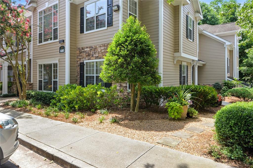 2400 Cumberland Parkway Southeast, Unit 611 Atlanta, GA 30339 - Photo 25 of 26 a view of a building with potted plants