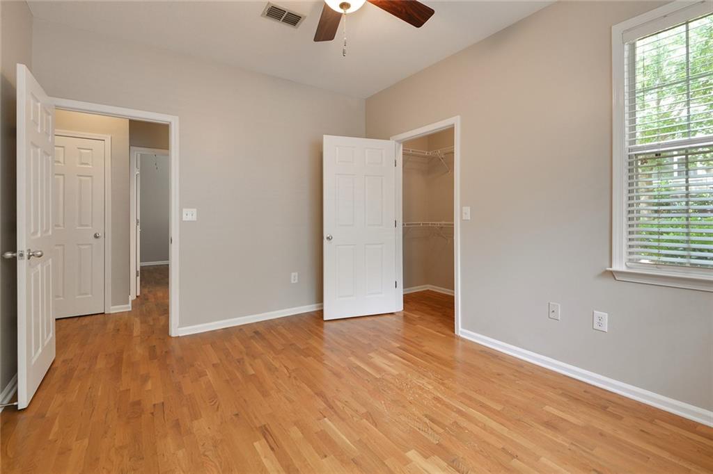 2400 Cumberland Parkway Southeast, Unit 611 Atlanta, GA 30339 - Photo 7 of 26 wooden floor in an empty room with a window
