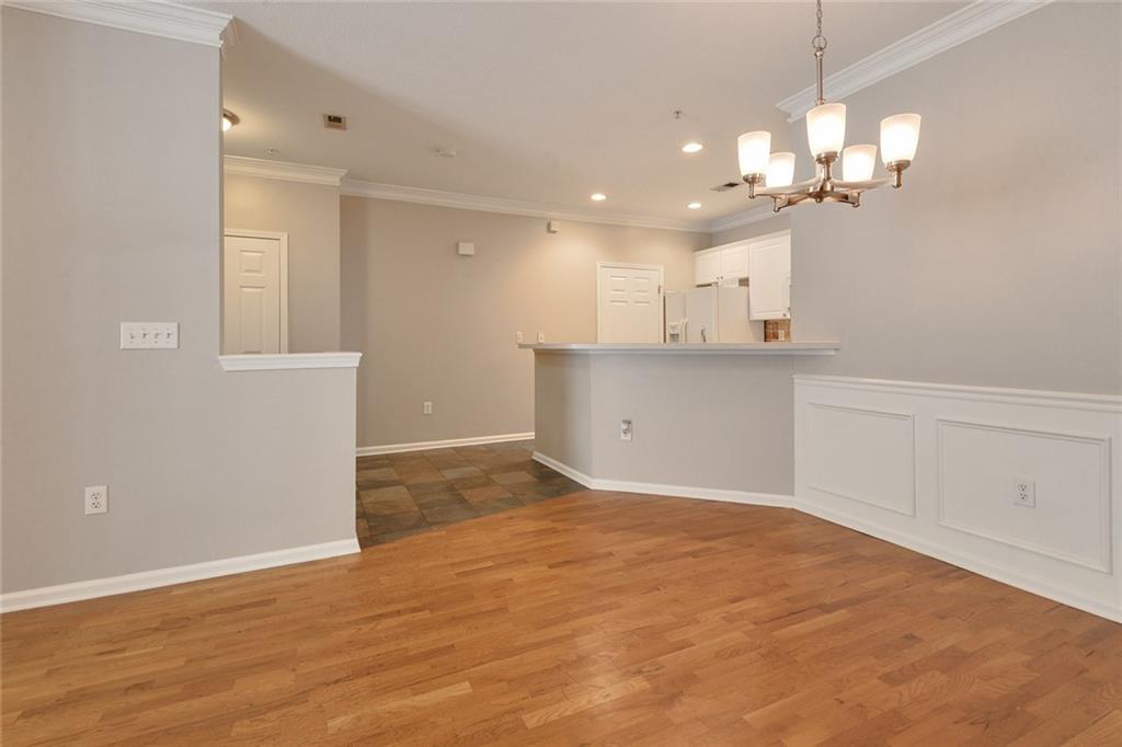 2400 Cumberland Parkway Southeast, Unit 611 Atlanta, GA 30339 - Photo 10 of 26 a view of a kitchen with a dishwasher cabinets and a large window