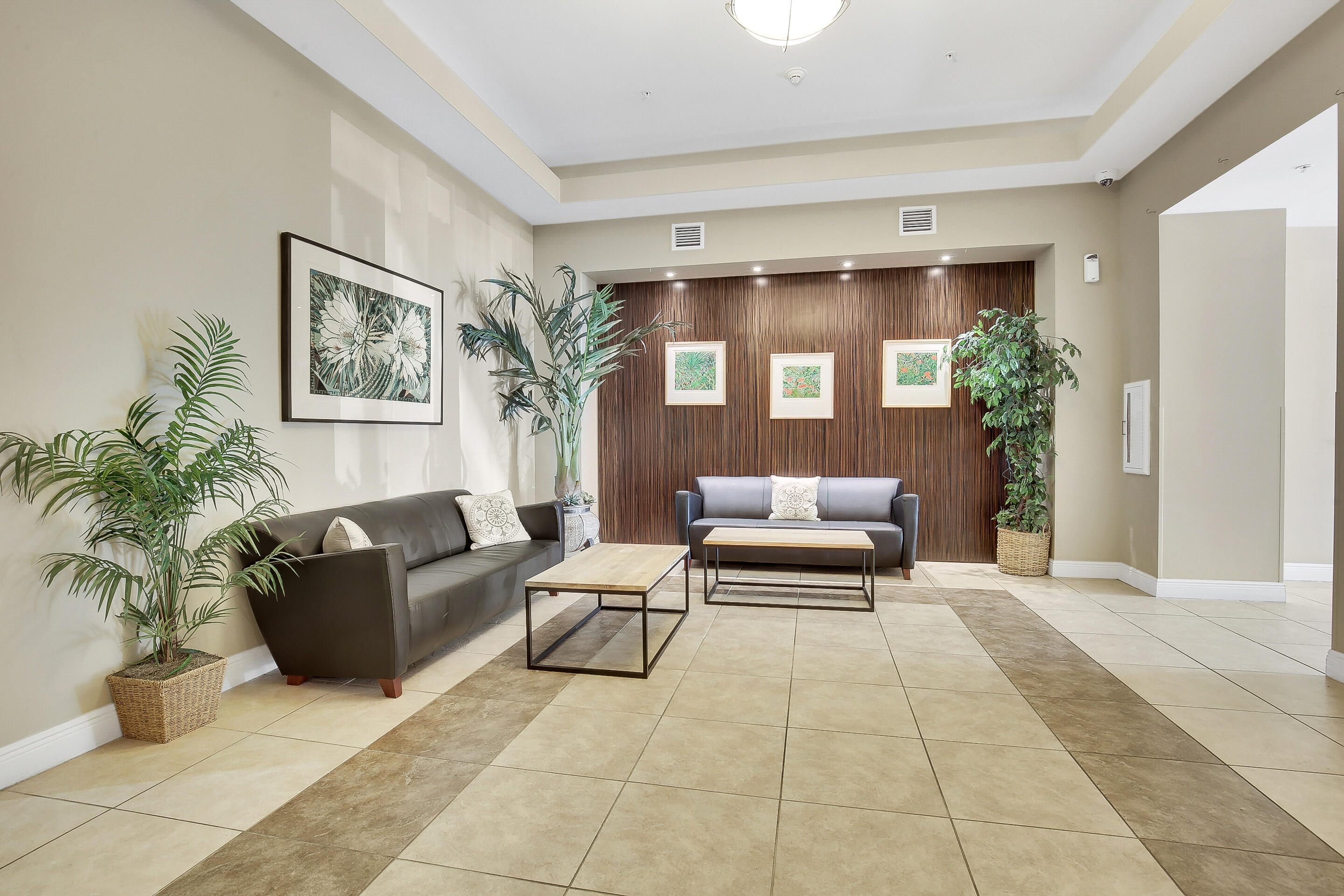 610 Clematis Street, Unit 736 West Palm Beach, FL 33401 - Photo 16 of 37 a bedroom with furniture and a potted plant