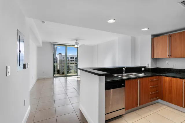 a kitchen with stainless steel appliances granite countertop a sink and cabinets