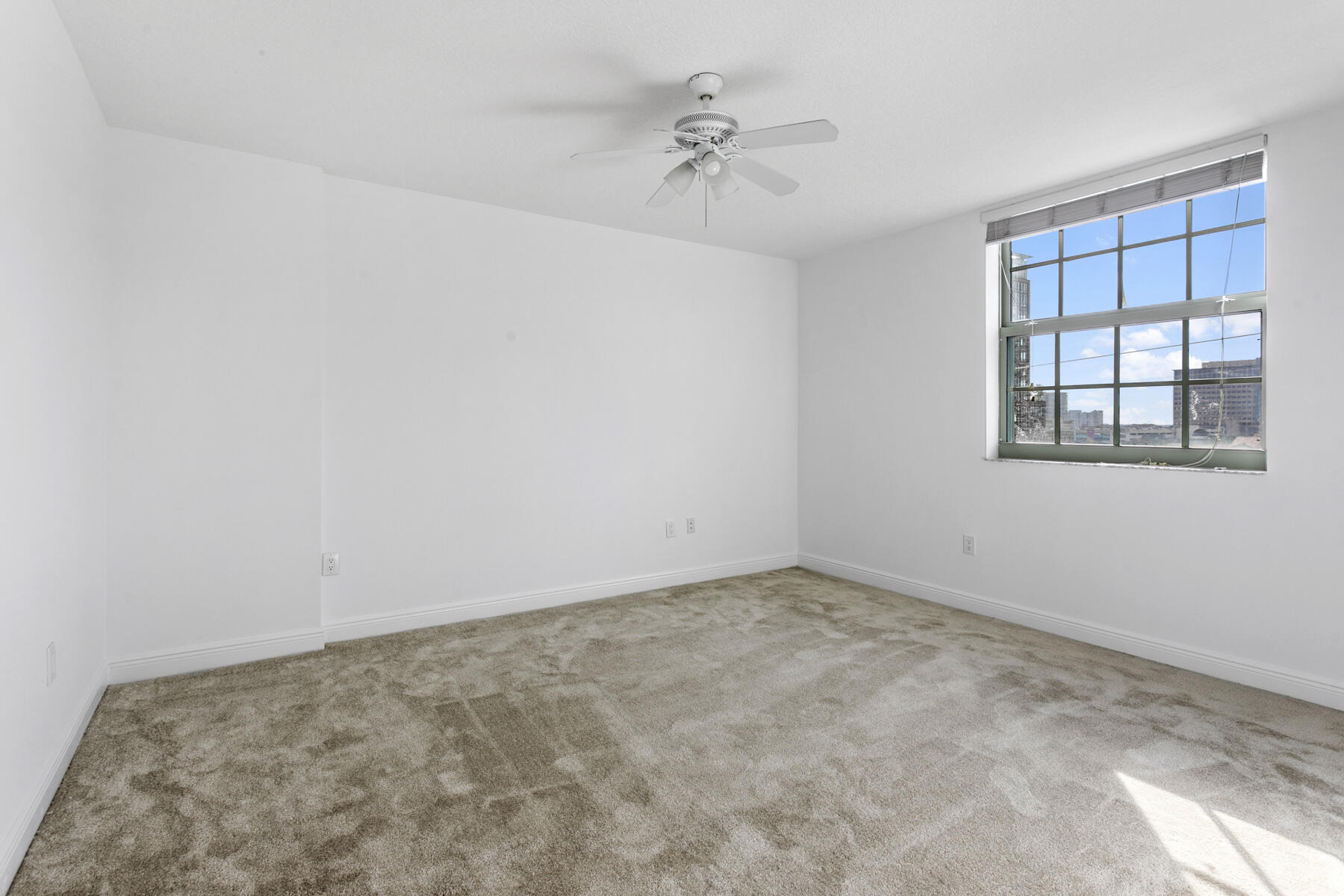 610 Clematis Street, Unit 736 West Palm Beach, FL 33401 - Photo 27 of 37 a view of an empty room with a window