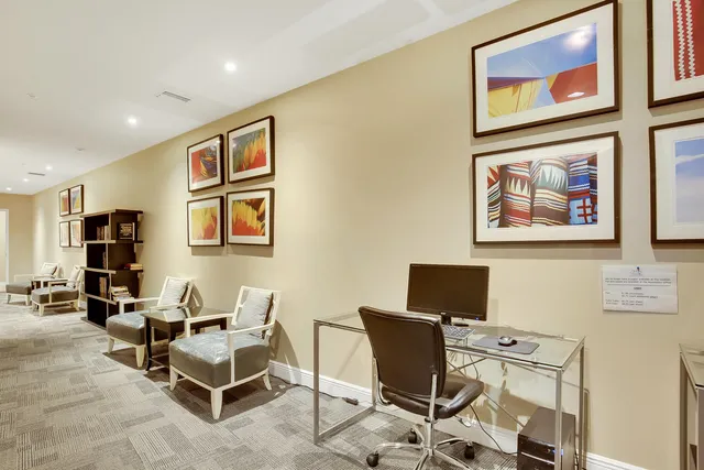 a view of a workspace with furniture and a couch
