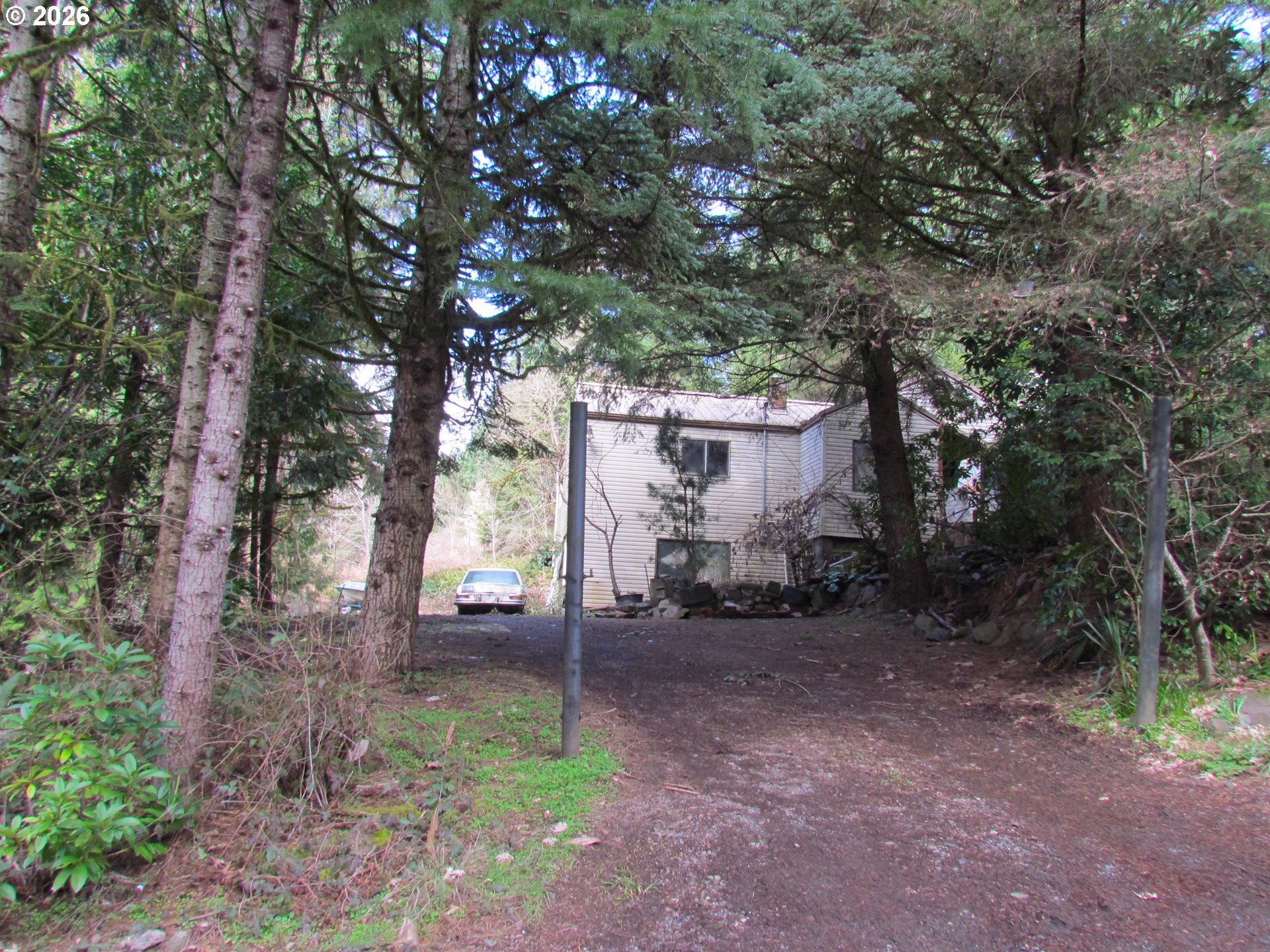 31191 New Kirk Road Scappoose, OR 97056 - Photo 4 of 10 a backyard of a house with lots of green space