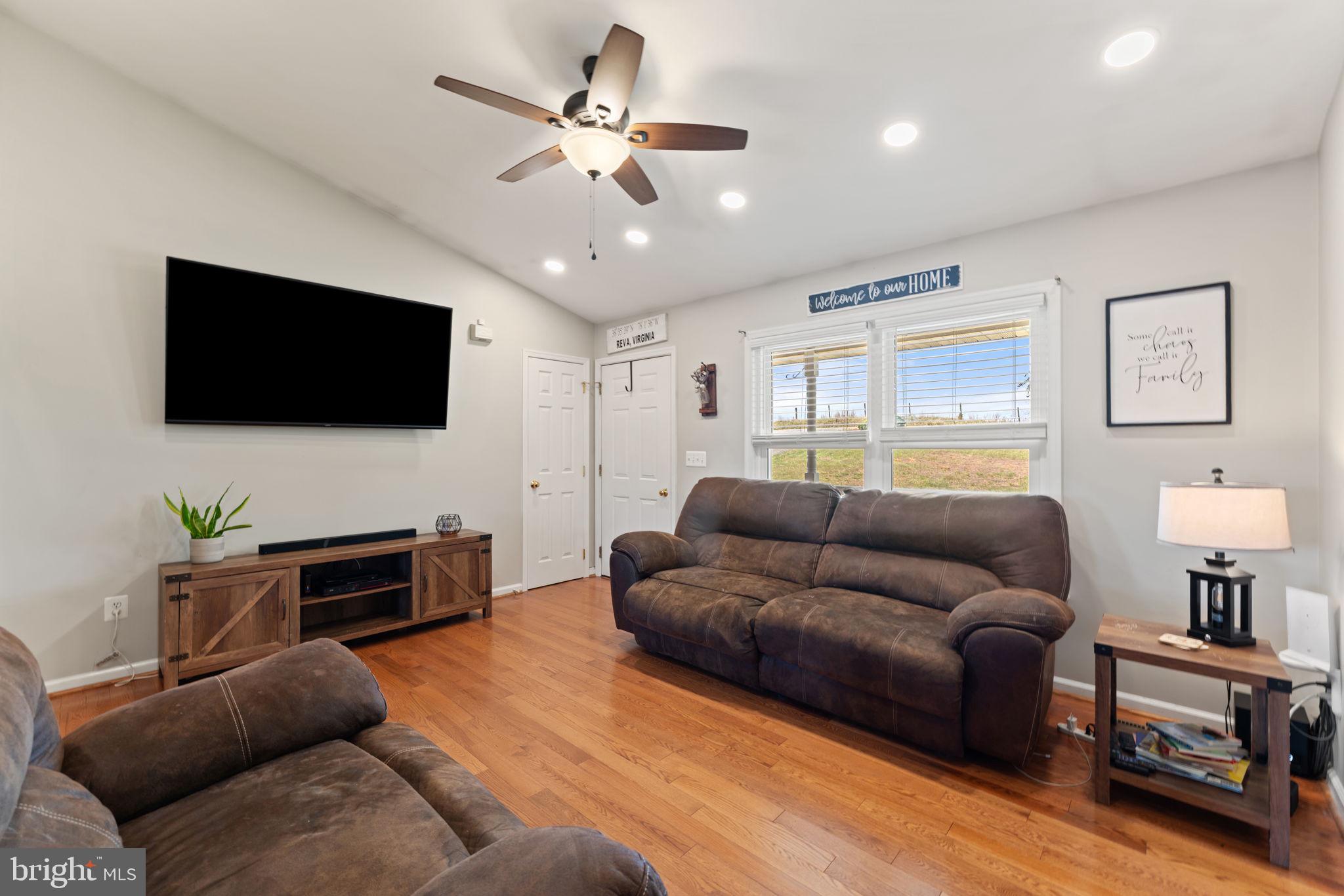1388 Novum Church Road Reva, VA 22735 - Photo 12 of 65 a living room with furniture and a flat screen tv