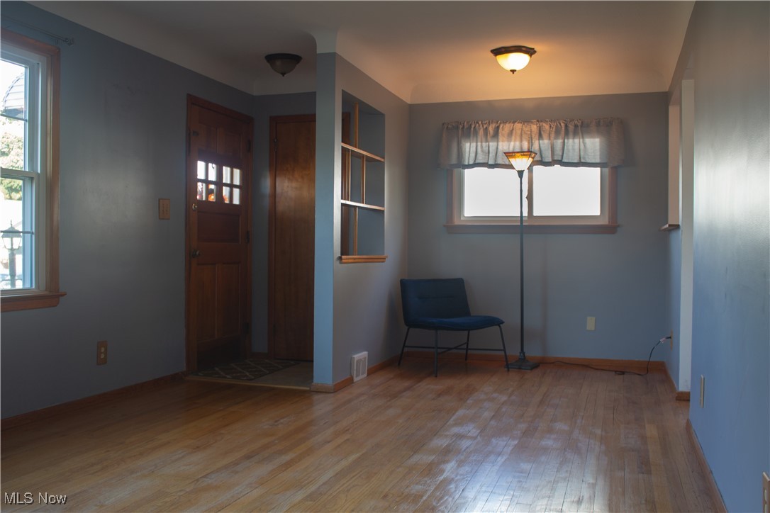 Living room featuring hardwood floors.