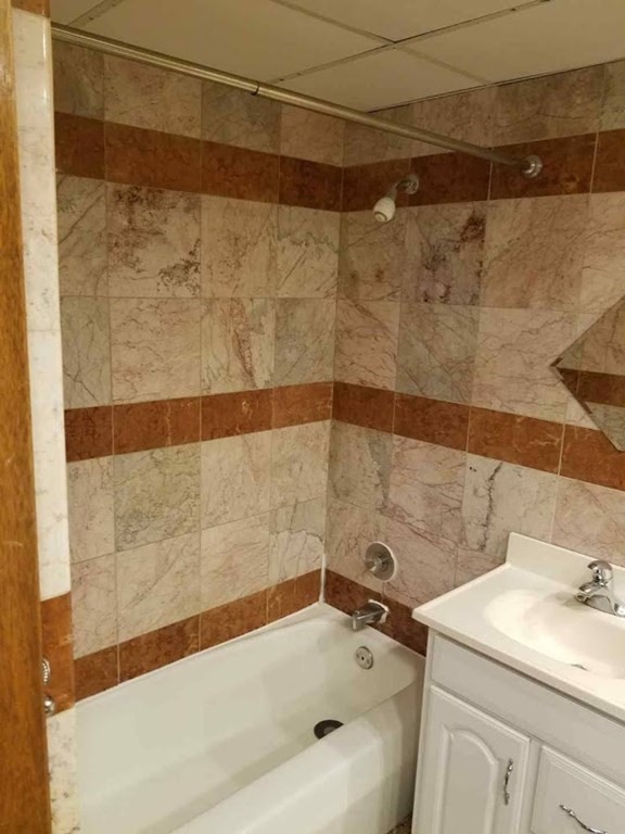 10 Main Street, Unit 507 Framingham, MA 01702 - Photo 17 of 17 a bathroom with a sink and a bathtub