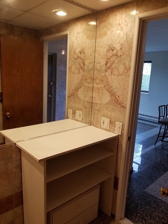 10 Main Street, Unit 507 Framingham, MA 01702 - Photo 10 of 17 a room with a table and chairs