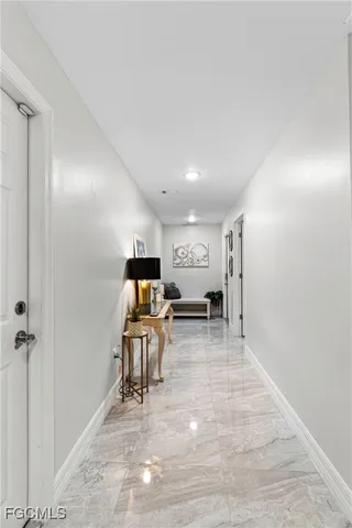 a view of a room with lots of furniture and wooden floor