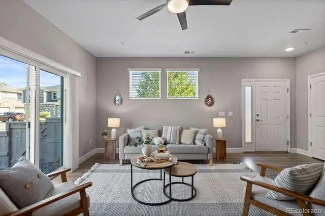 a living room with furniture and a window