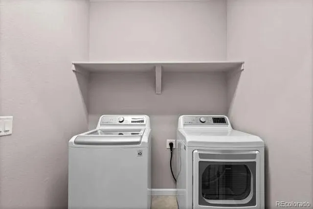 front view of a house with a fence