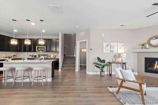 a large open kitchen with a table and chairs
