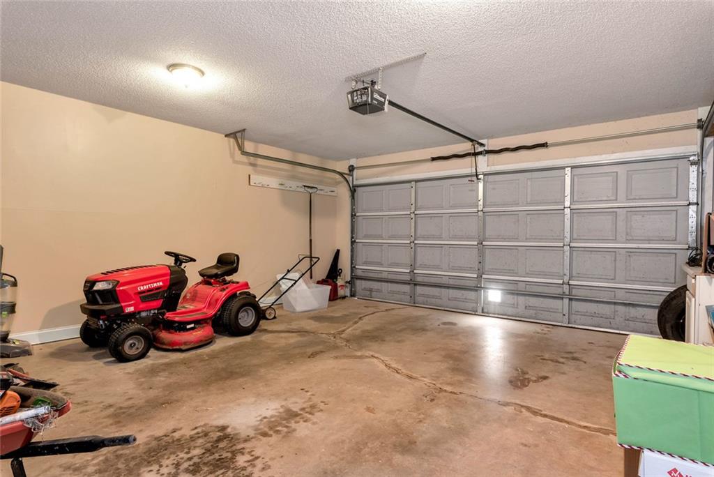 1044 Lothridge Road Cleveland, GA 30528 - Photo 38 of 40 a view of a garage with parked cars