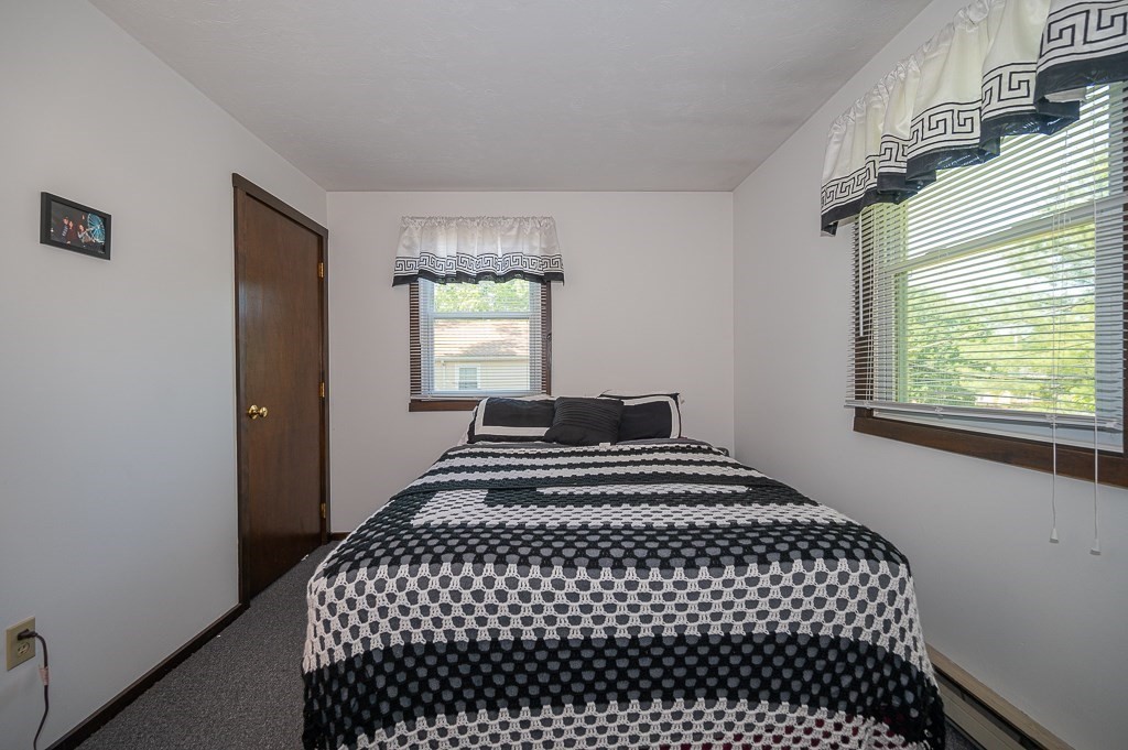 25 Agate Avenue Worcester, MA 01604 - Photo 12 of 34 a bedroom with a bed and window