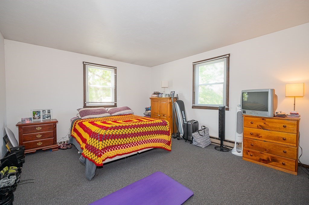 25 Agate Avenue Worcester, MA 01604 - Photo 13 of 34 a bedroom with a bed and a tv in it