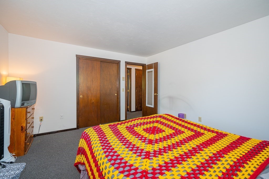 25 Agate Avenue Worcester, MA 01604 - Photo 14 of 34 a bedroom with a bed and a dresser