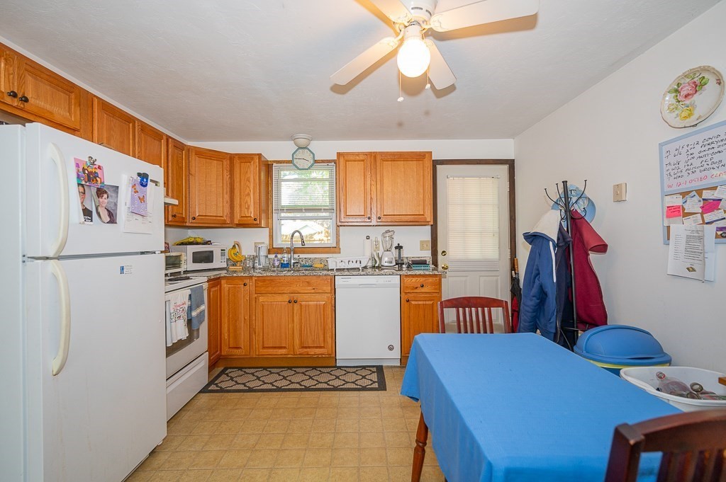 25 Agate Avenue Worcester, MA 01604 - Photo 16 of 34 a kitchen with stainless steel appliances granite countertop a refrigerator and a sink