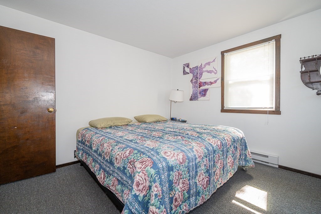 25 Agate Avenue Worcester, MA 01604 - Photo 21 of 34 a bedroom with a bed and a window